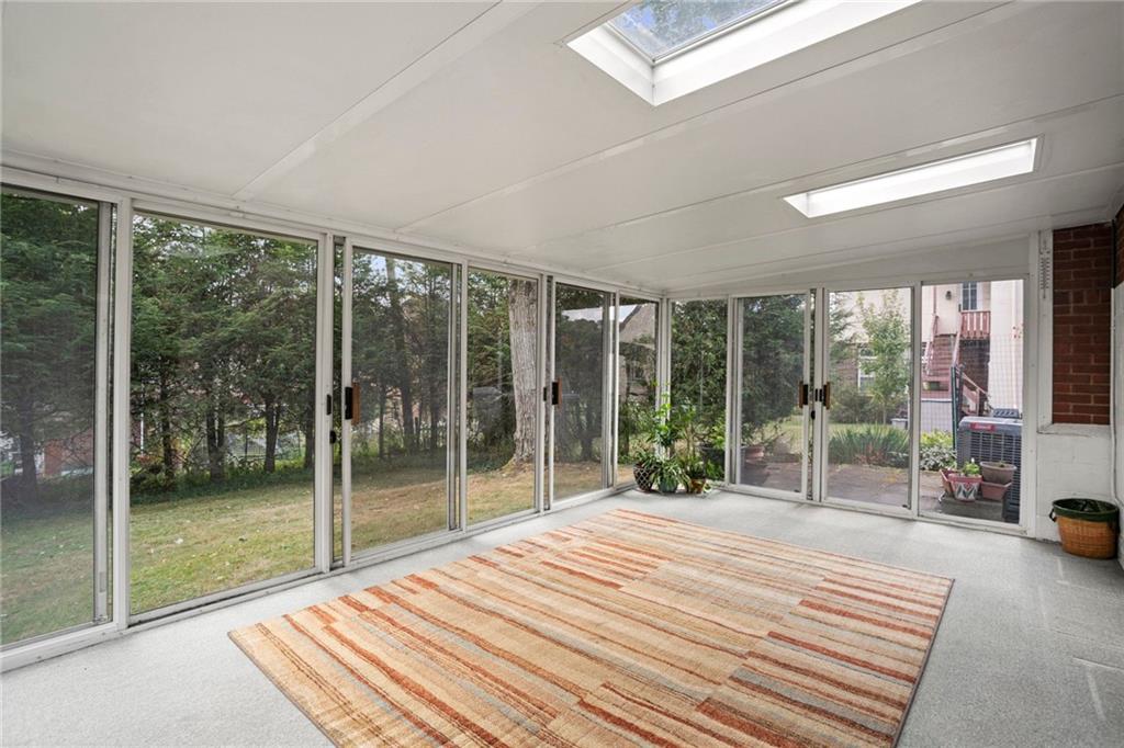 3323 Shady Ave Extension Pittsburgh, PA 15217 - Photo 34 of 45 a bedroom with a bed and a view of balcony