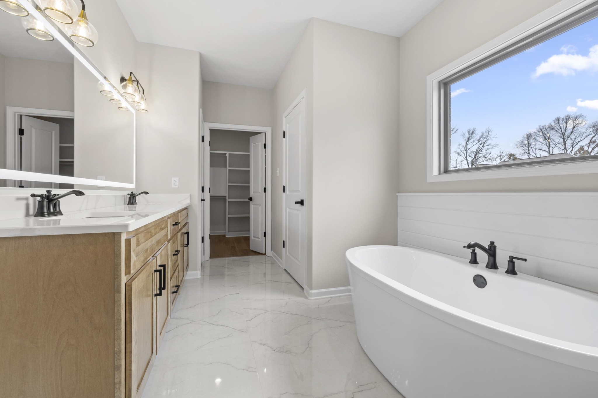 180 Oakland Rdg Cove Oakland, TN 38060 - Photo 15 of 27 a spacious bathroom with a tub sink and mirror
