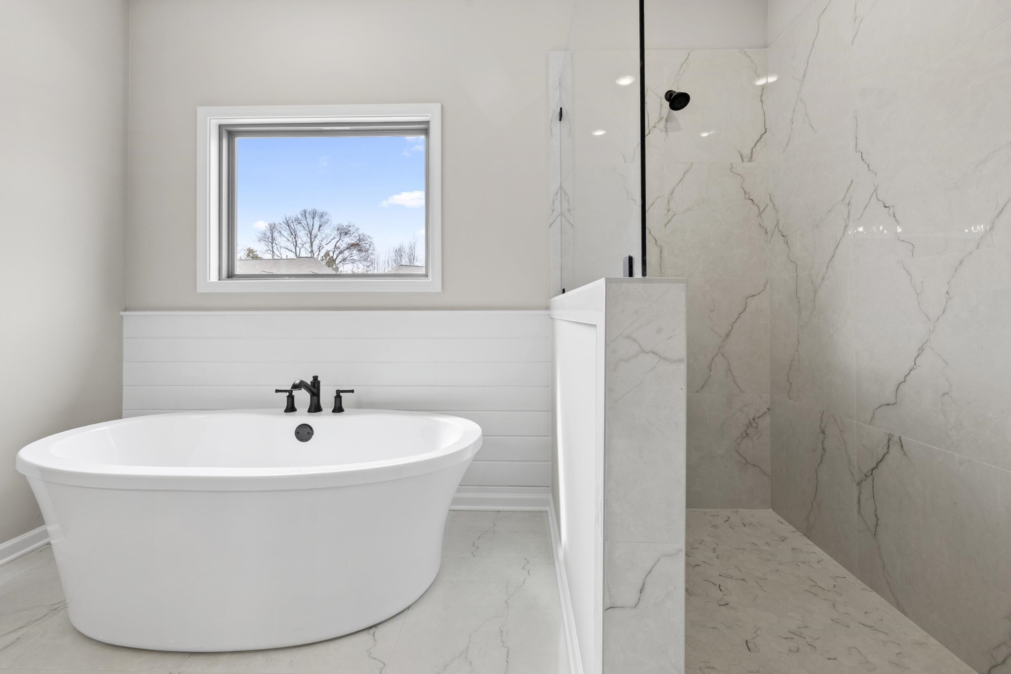 180 Oakland Rdg Cove Oakland, TN 38060 - Photo 27 of 27 a white bath tub sitting in a bathroom