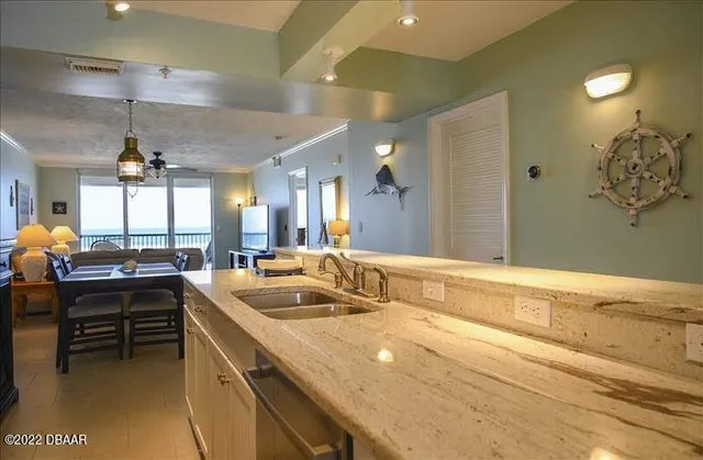 a spacious bathroom with a sink a large mirror and a shower