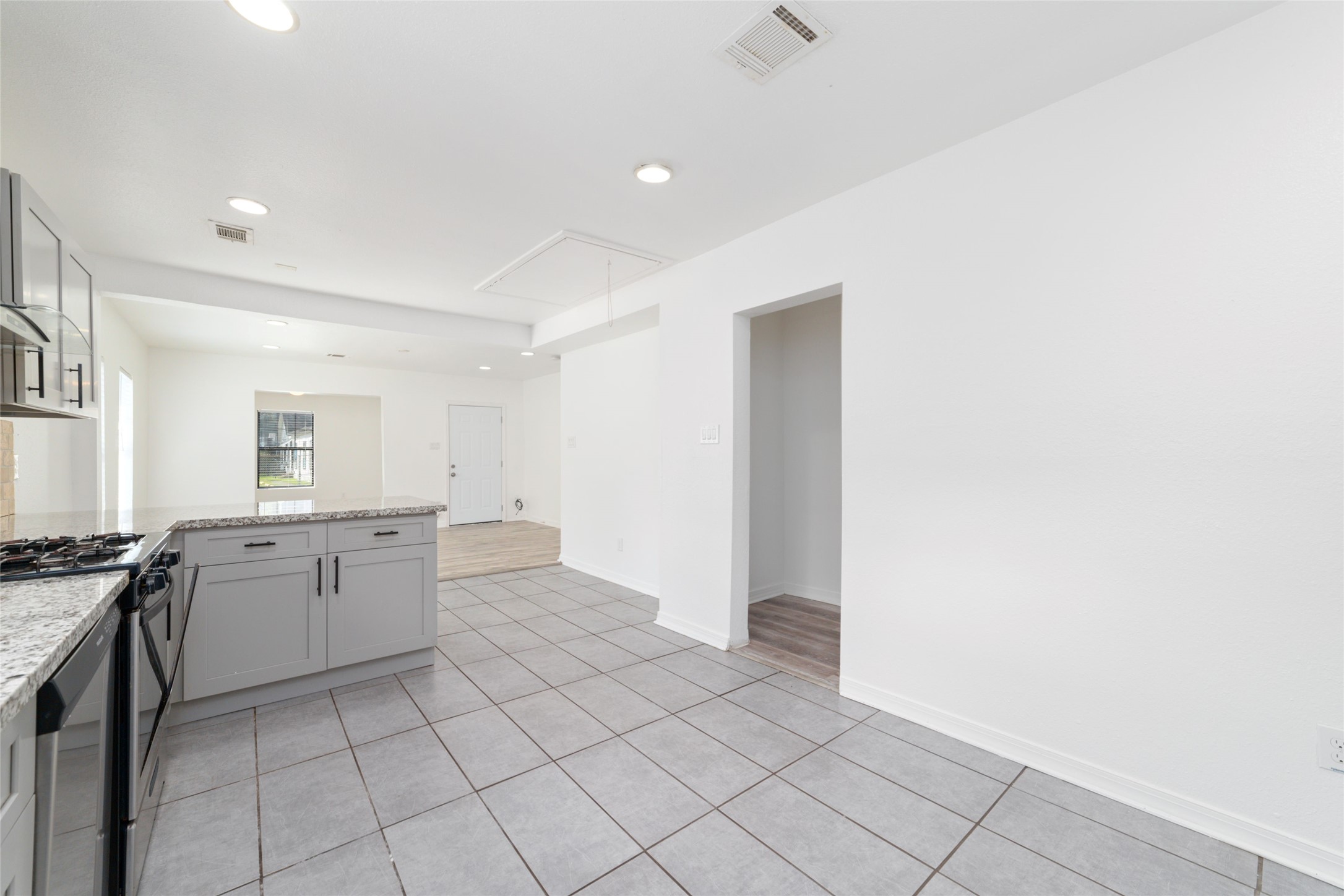 433 Calloway Street Houston, TX 77029 - Photo 12 of 29 a view of a kitchen with granite countertop cabinets