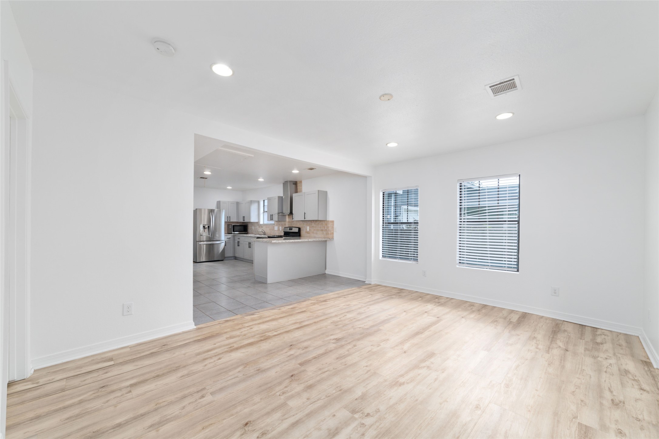 433 Calloway Street Houston, TX 77029 - Photo 7 of 29 a view of kitchen with wooden floor