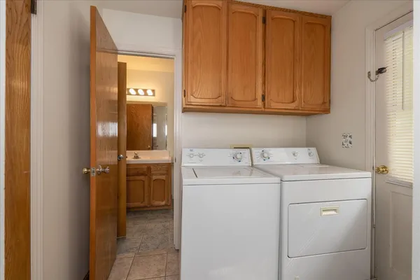 a utility room with dryer and washer
