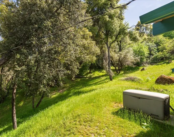 a view of a yard with an outdoor space