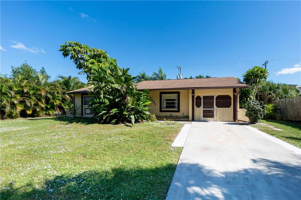 2431 Gentian Road Venice, FL 34293 - Photo 1 of 1 a front view of a house with a yard