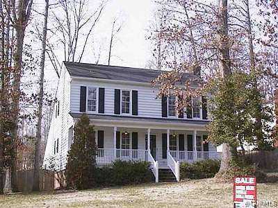 4806 Ball Cypress Road Chesterfield, VA 23832 - Photo 1 of 1 a front view of a house with garden and trees