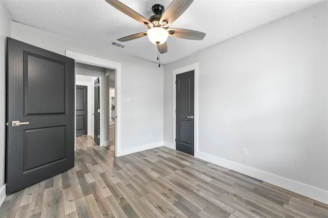 a view of a livingroom with a chandelier fan