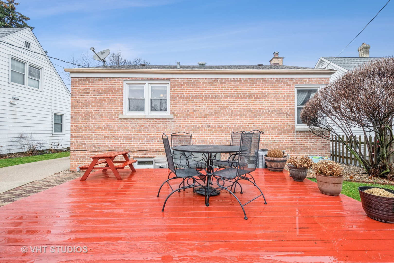 697 Greenview Avenue Des Plaines, IL 60016 - Photo 18 of 25 a view of a patio with dining table and chairs with wooden floor