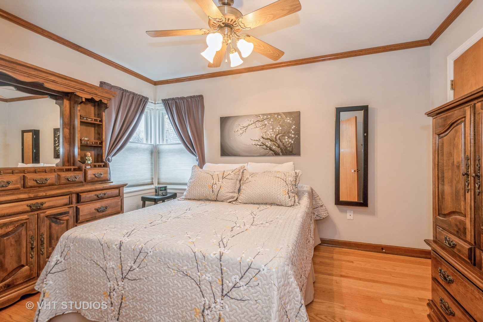 697 Greenview Avenue Des Plaines, IL 60016 - Photo 9 of 25 a bedroom with a bed and a chandelier