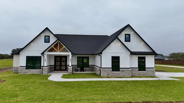 a view of a house with swimming pool and a yard