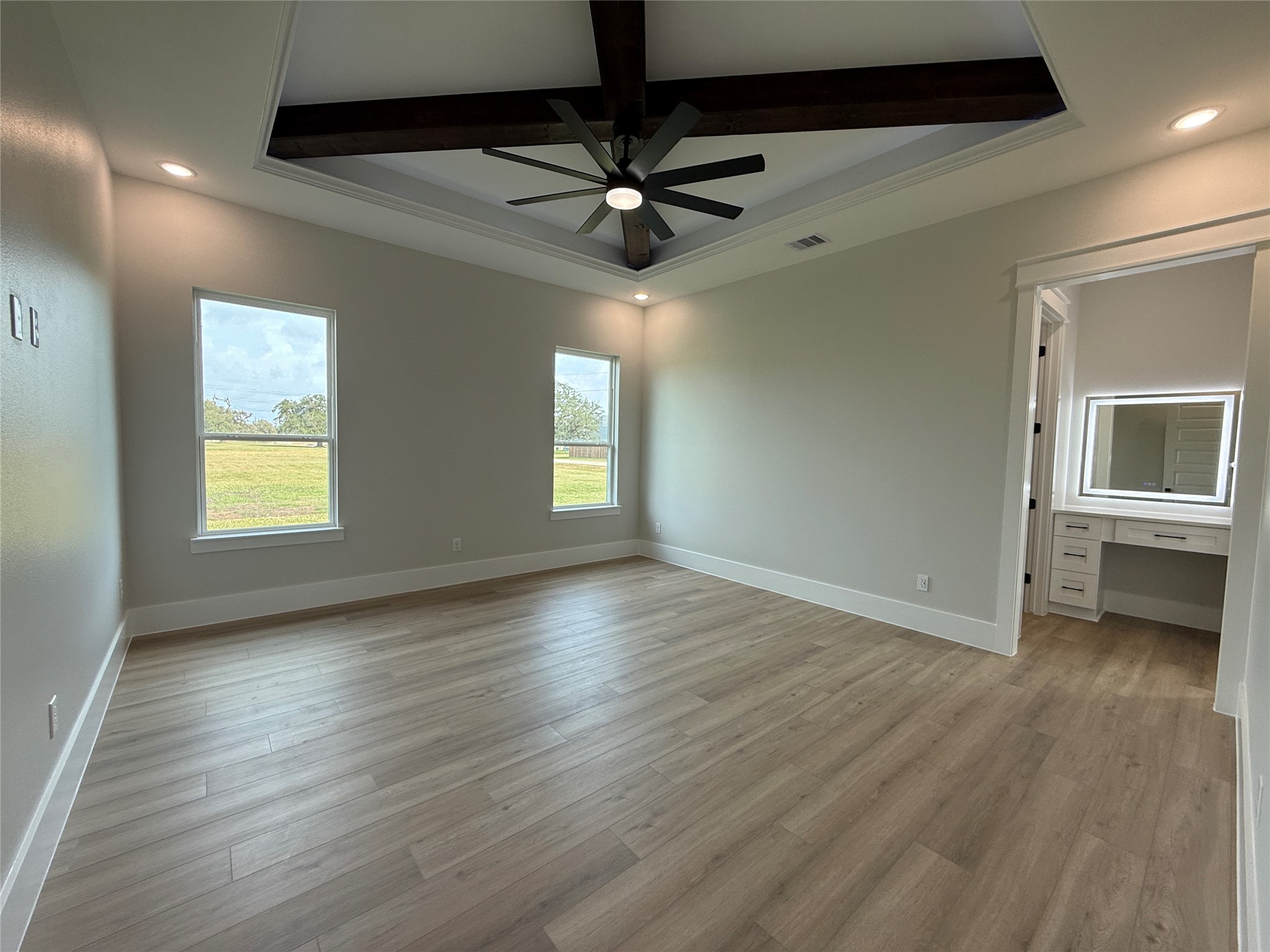 1208 Quarter Horse Trail Angleton, TX 77515 - Photo 11 of 23 a view of an empty room with a window and wooden floor