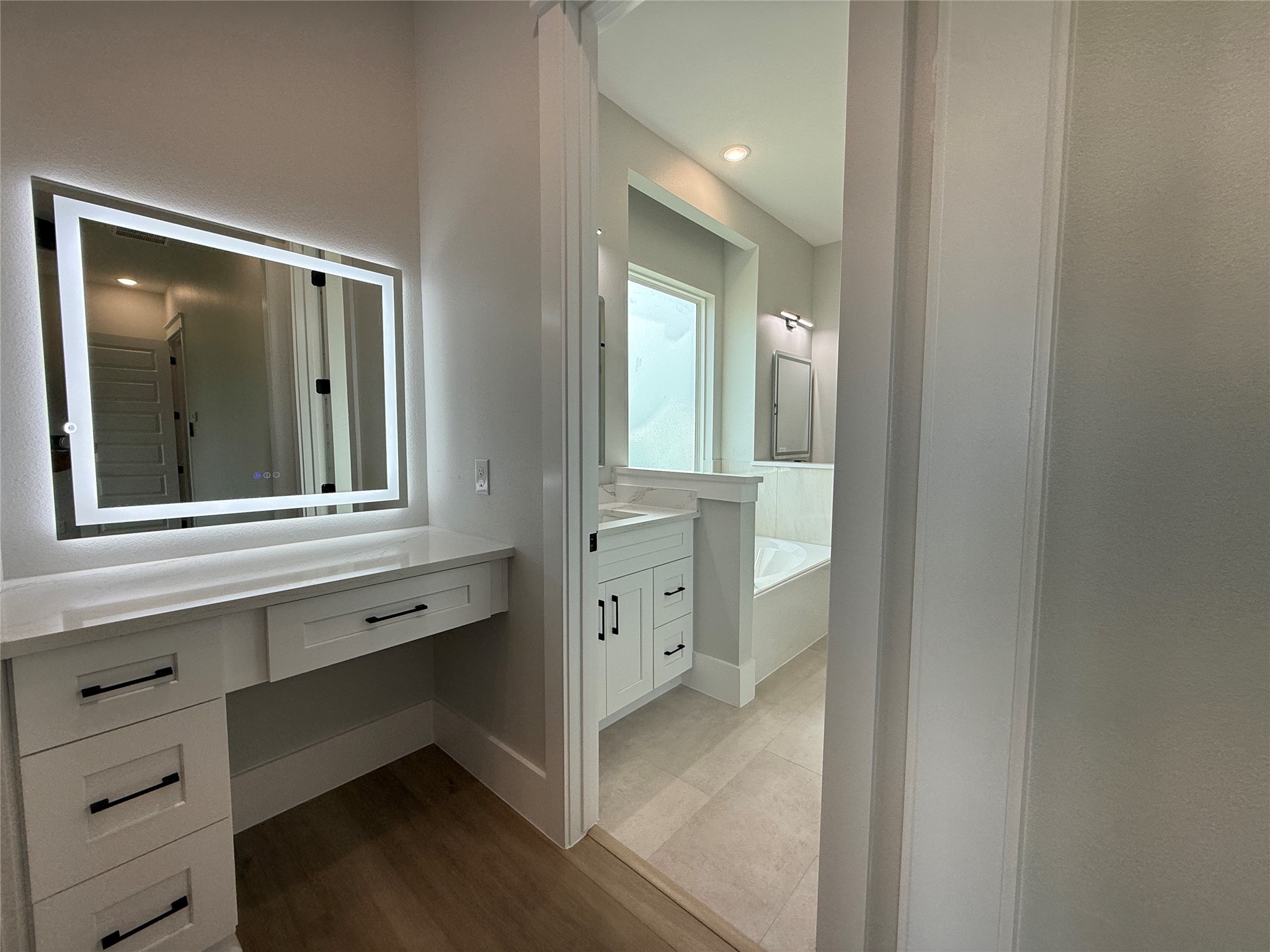 1208 Quarter Horse Trail Angleton, TX 77515 - Photo 12 of 23 a view of a hallway with windows and cabinet