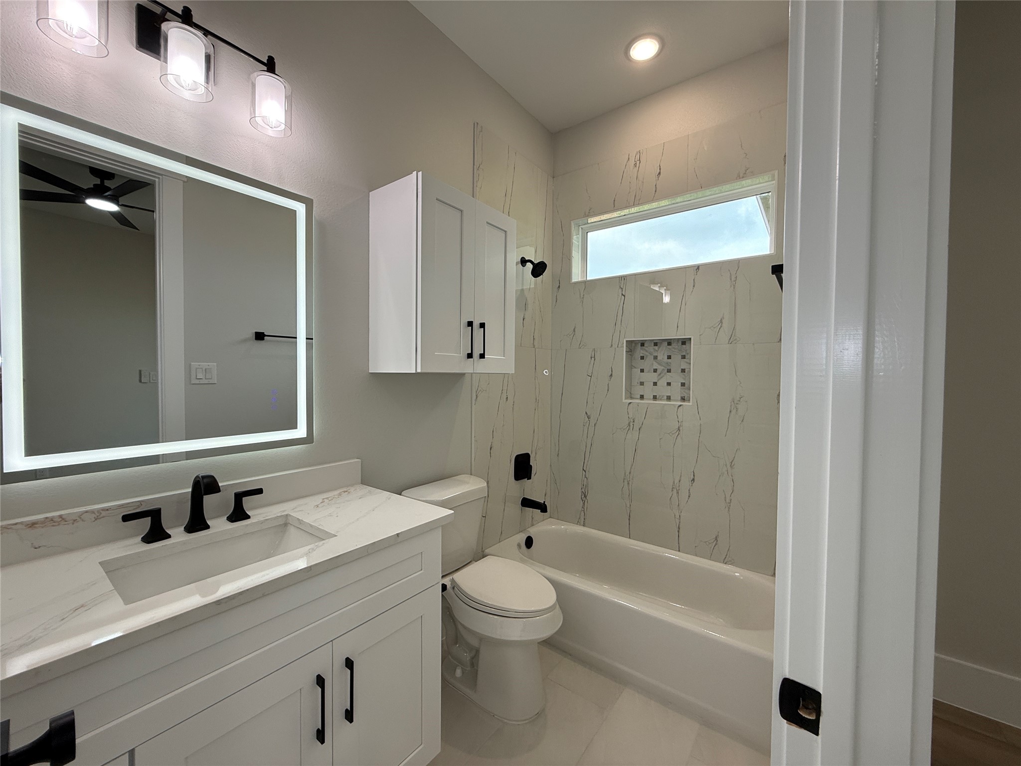 1208 Quarter Horse Trail Angleton, TX 77515 - Photo 16 of 23 a bathroom with a bathtub shower sink vanity granite and toilet