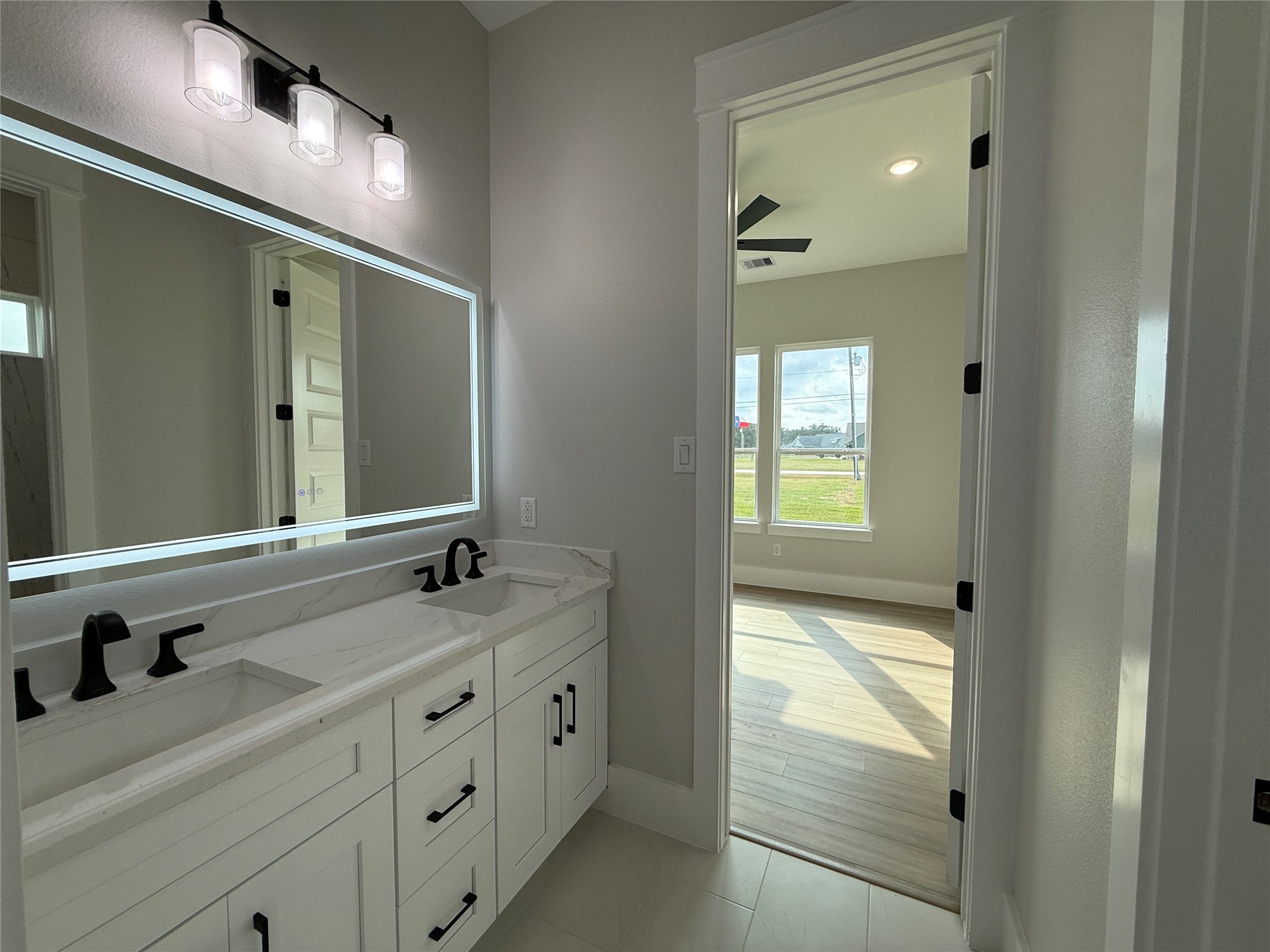 1208 Quarter Horse Trail Angleton, TX 77515 - Photo 17 of 23 a bathroom with double vanity sink and mirror