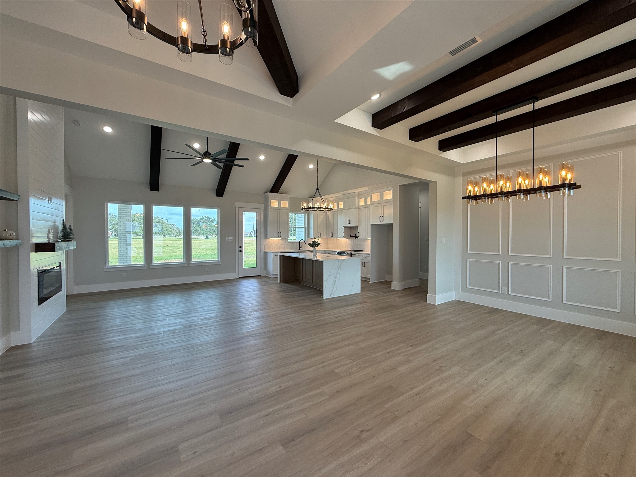 1208 Quarter Horse Trail Angleton, TX 77515 - Photo 18 of 23 a view of an empty room with wooden floor kitchen view and a window