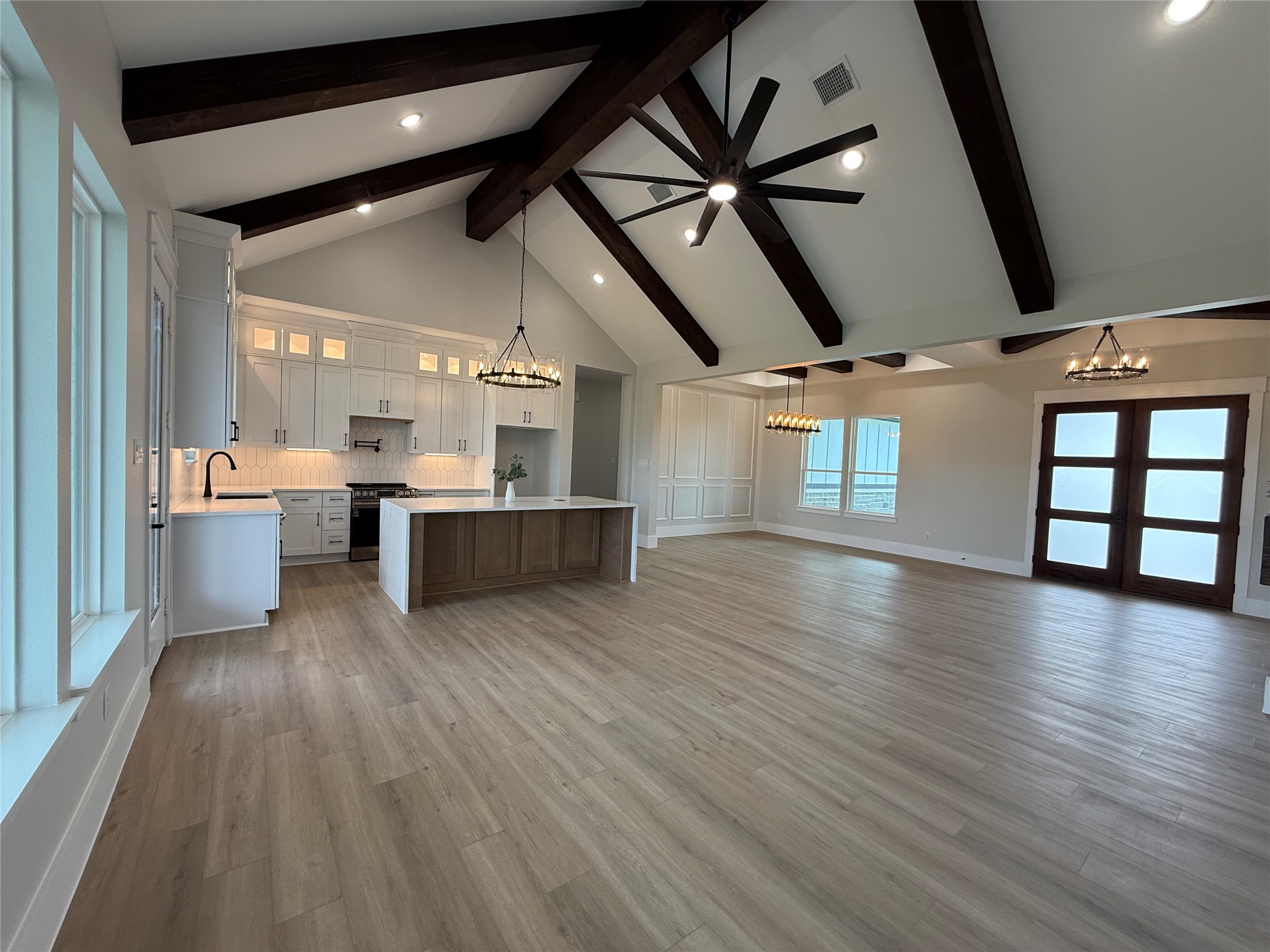 1208 Quarter Horse Trail Angleton, TX 77515 - Photo 19 of 23 a view of a big room with wooden floor and windows