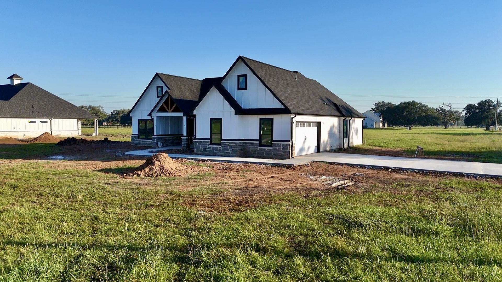 1208 Quarter Horse Trail Angleton, TX 77515 - Photo 22 of 23 a front view of a house with a yard table and chairs