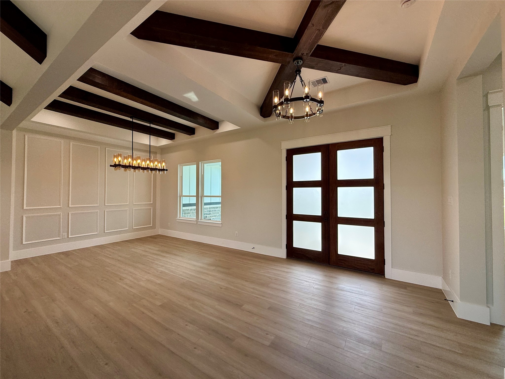 1208 Quarter Horse Trail Angleton, TX 77515 - Photo 3 of 23 a view of an empty room with window and wooden floor