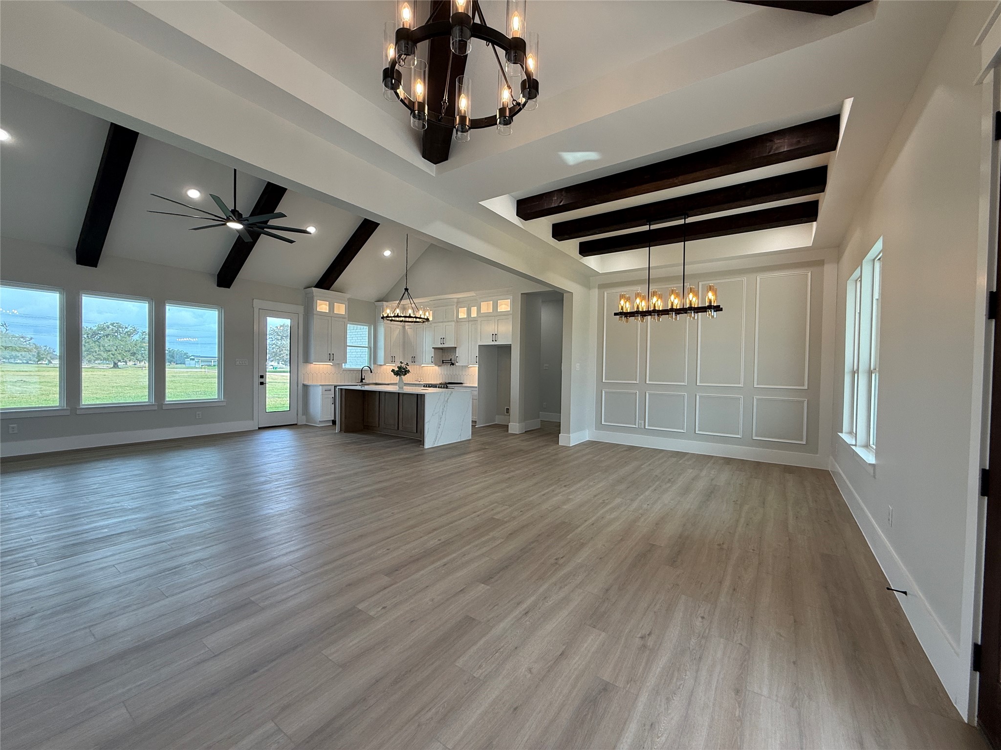 1208 Quarter Horse Trail Angleton, TX 77515 - Photo 4 of 23 wooden floor in an empty room with a window