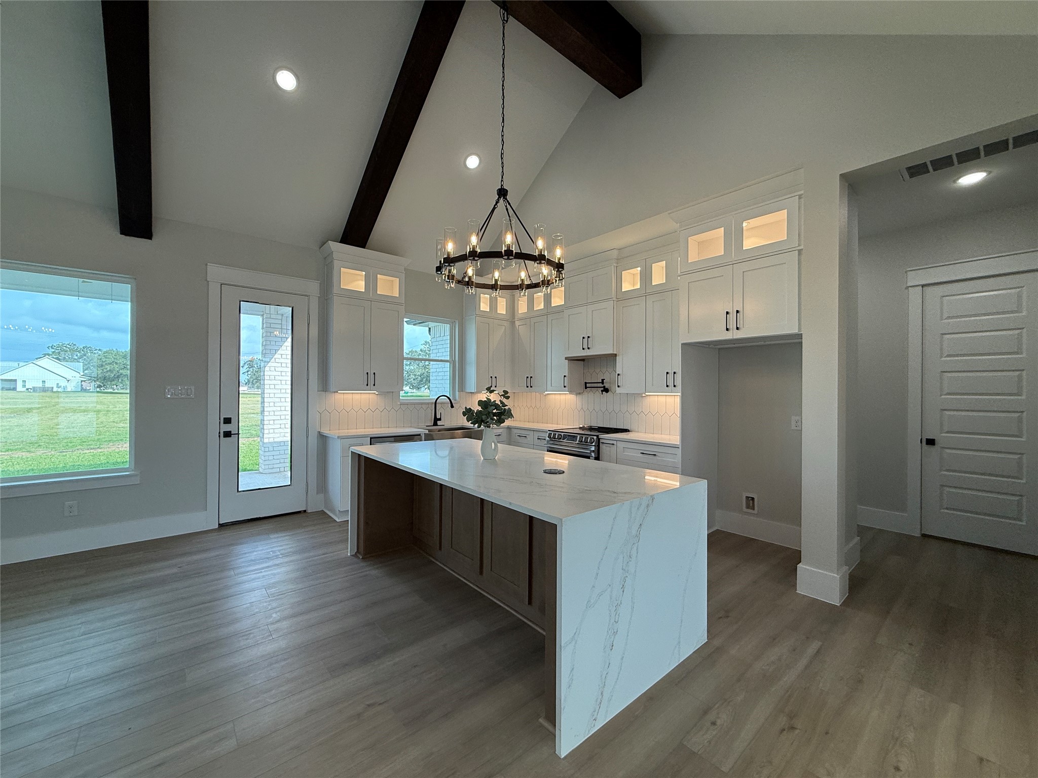 1208 Quarter Horse Trail Angleton, TX 77515 - Photo 6 of 23 an open kitchen with a sink and dish washer