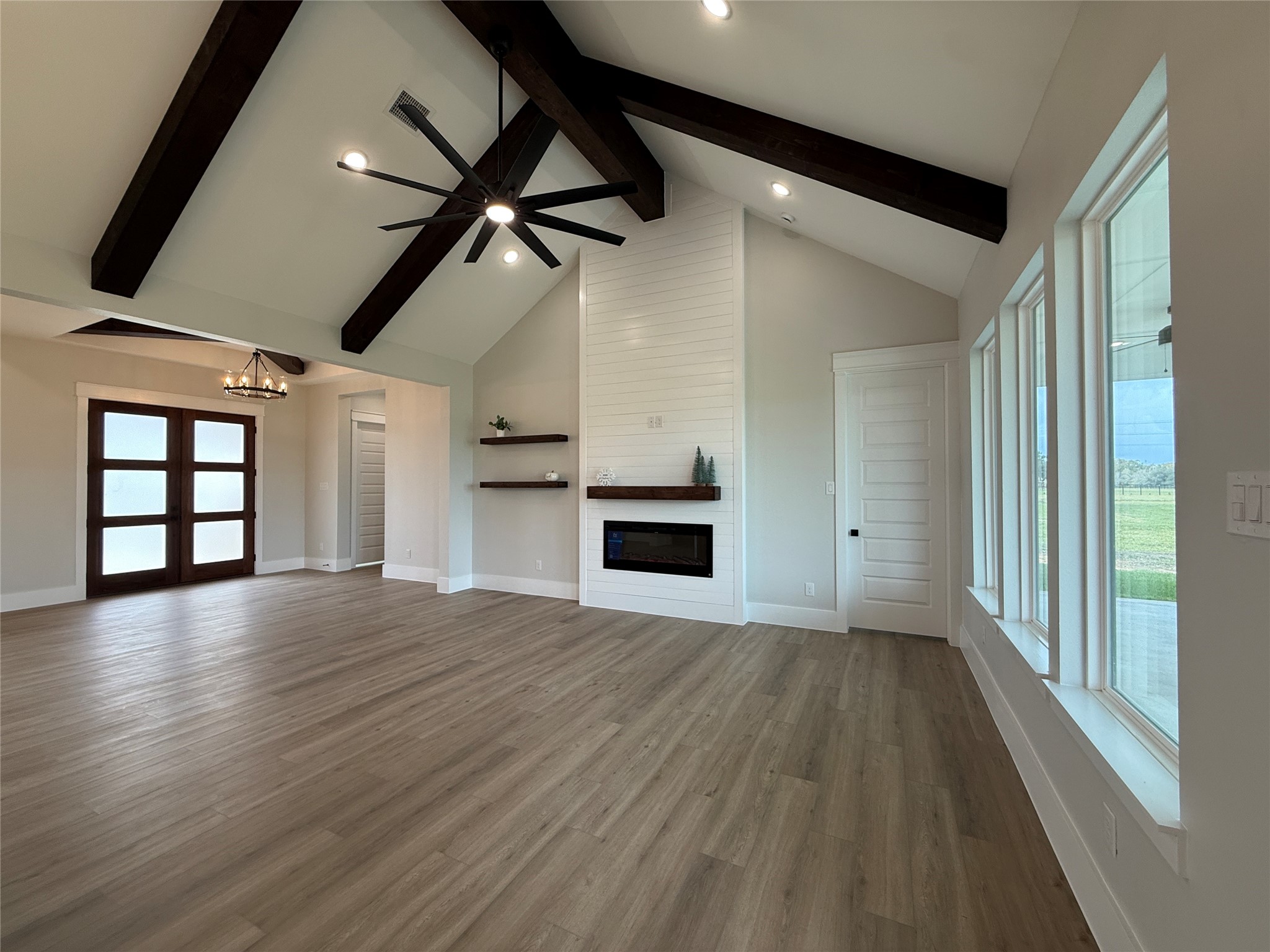 1208 Quarter Horse Trail Angleton, TX 77515 - Photo 10 of 23 a view of empty room with wooden floor and fan