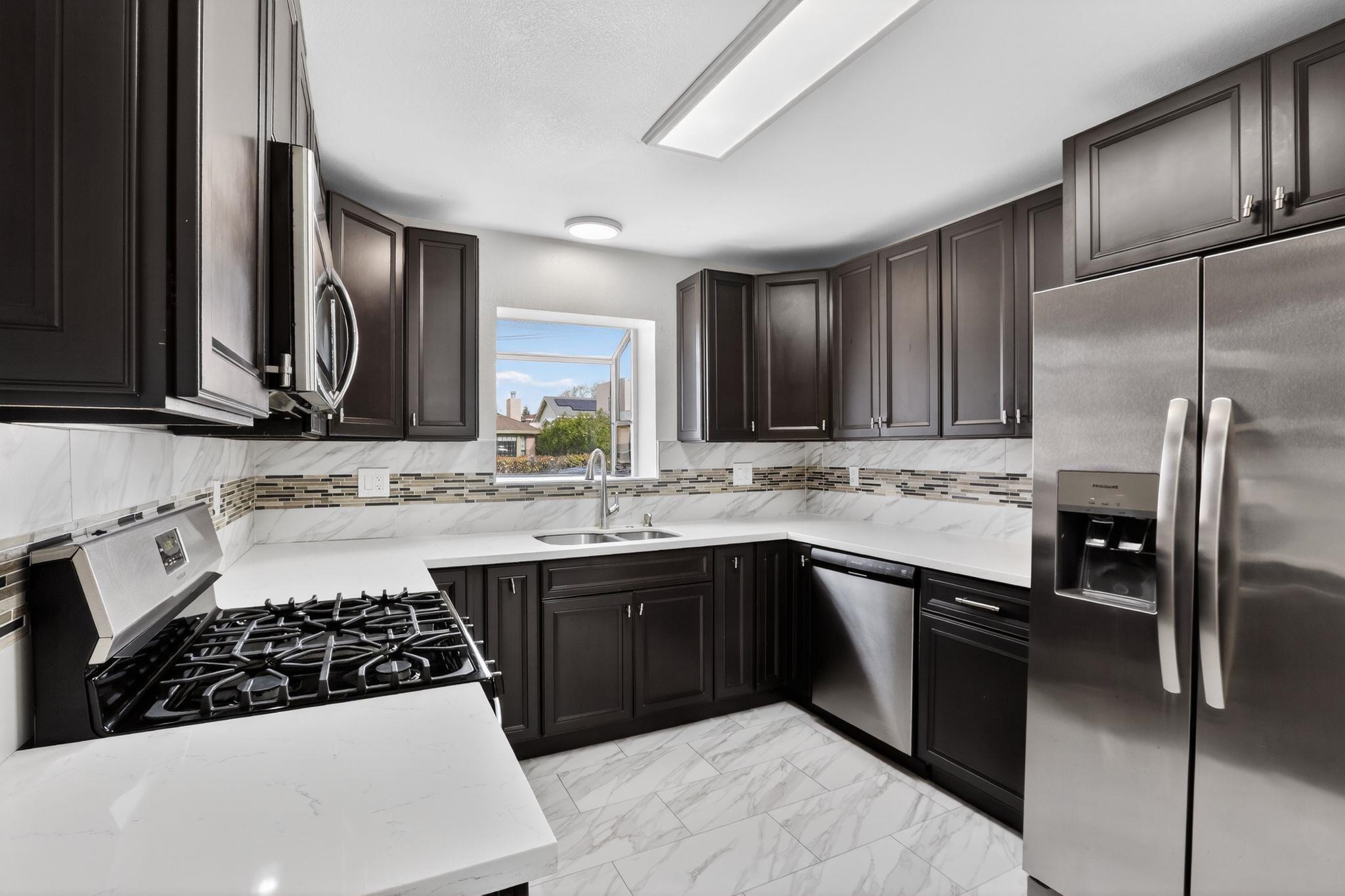 3287 Kelly Street Hayward, CA 94541 - Photo 15 of 32 a kitchen with a sink stove and refrigerator