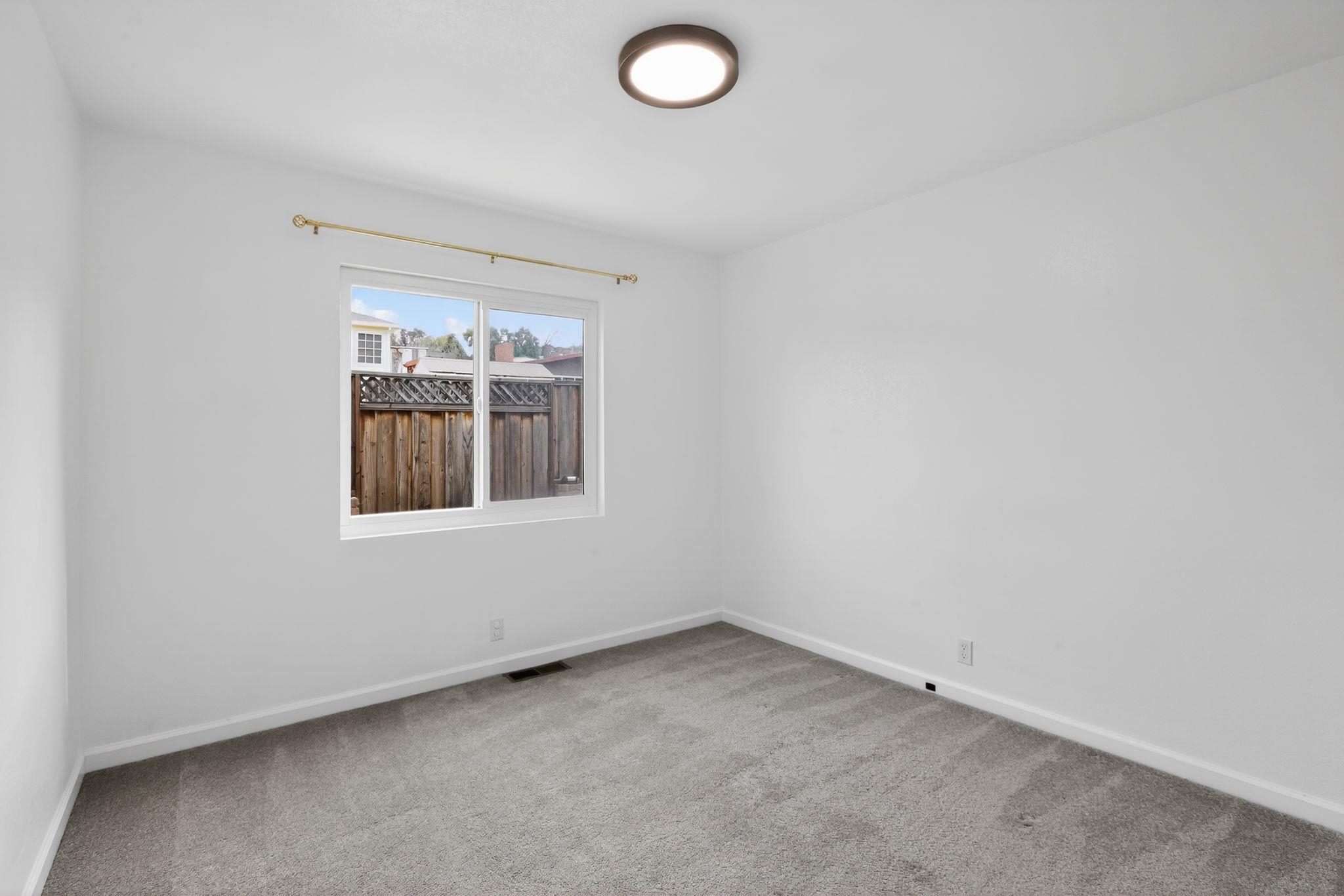 3287 Kelly Street Hayward, CA 94541 - Photo 20 of 32 an empty room with windows