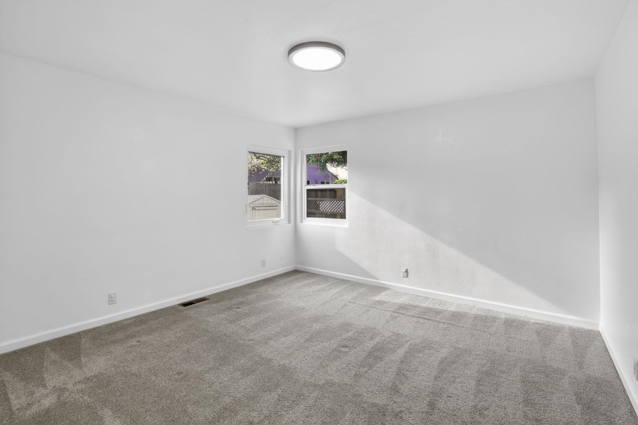 3287 Kelly Street Hayward, CA 94541 - Photo 21 of 32 an empty room with windows