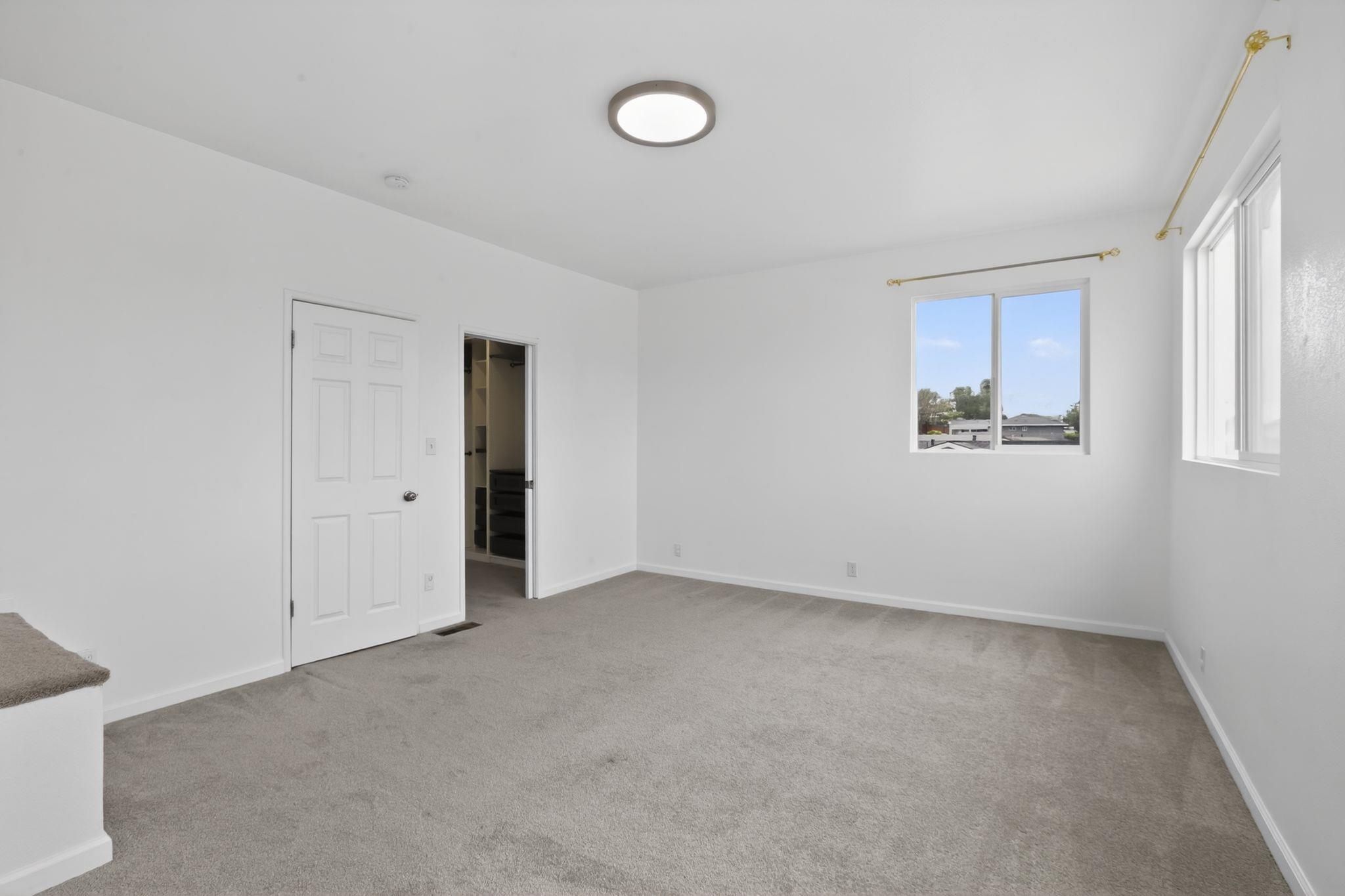 3287 Kelly Street Hayward, CA 94541 - Photo 23 of 32 an empty room with windows
