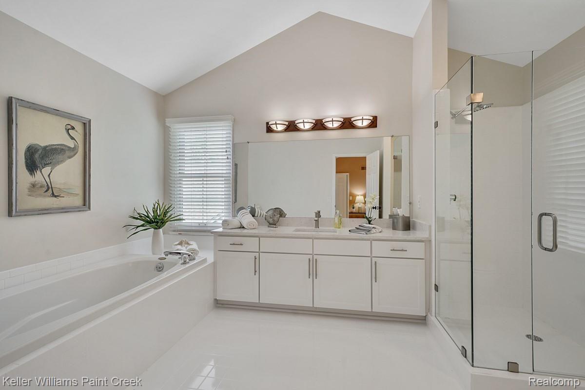 2641 Long Meadow Lane Rochester, MI 48307 - Photo 25 of 38 Spacious Master Bath with vaulted ceiling, Jacuzzi soaker tub, new quartz counter tops and Euro shower door.