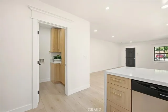 a view of a hallway to rooms