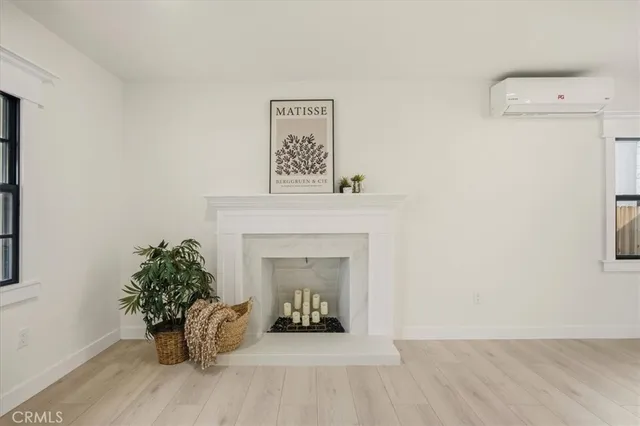 a view of a room with furniture and a fireplace