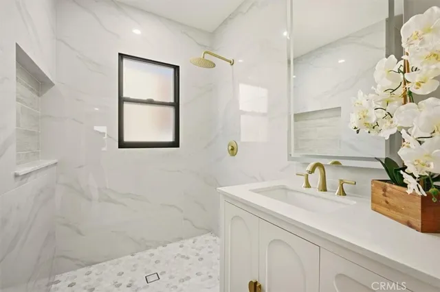 a bathroom with a sink and a mirror