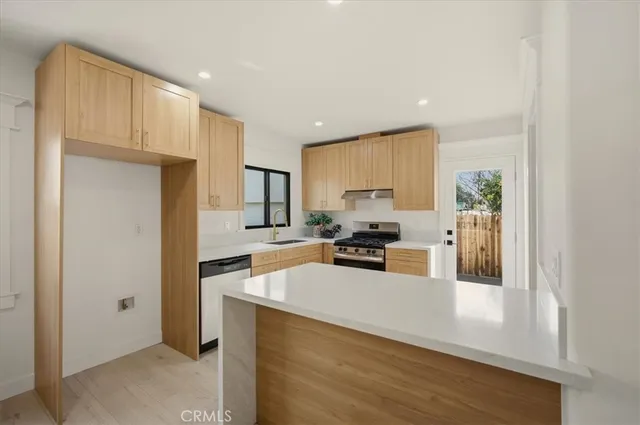 a large kitchen with a large window