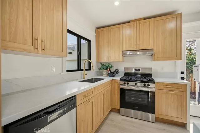 a kitchen with a stove and a sink