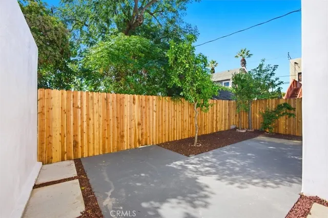 a view of a back yard with a street