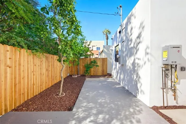 a view of a wooden door with a yard