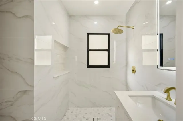 a bathroom with a bathtub and a shower