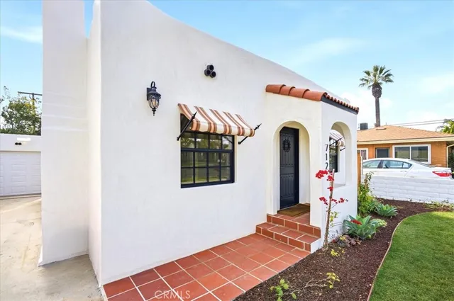 a front view of a house with garden