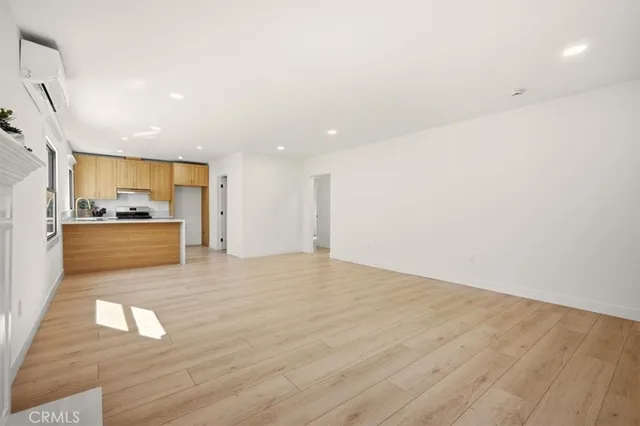 a view of a kitchen with a sink and a stove top oven