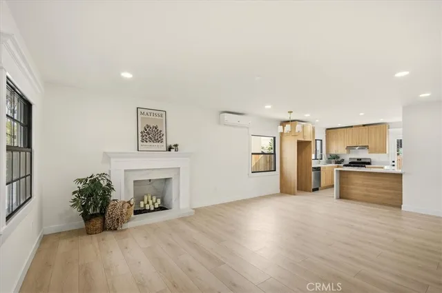 a view of a kitchen with furniture and a fireplace
