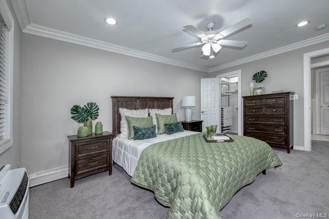 323 Terrace Road, Unit T08323 Bayport, NY 11705 - Photo 6 of 8 a bedroom with a bed dresser and a chandelier
