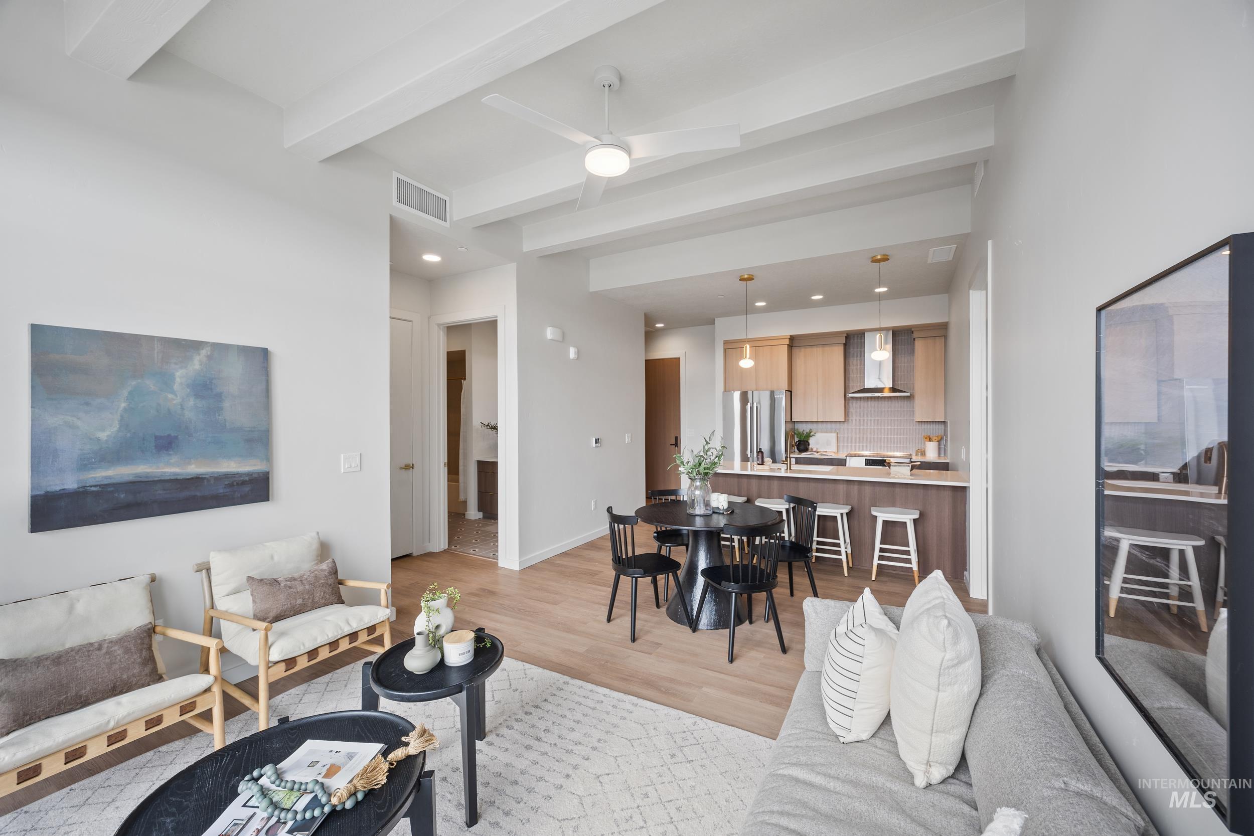 4340 East Haystack Street, Unit 305 Boise, ID 83716 - Photo 9 of 50 Living room with beamed ceiling, light wood-style flooring, a ceiling fan, and recessed lighting