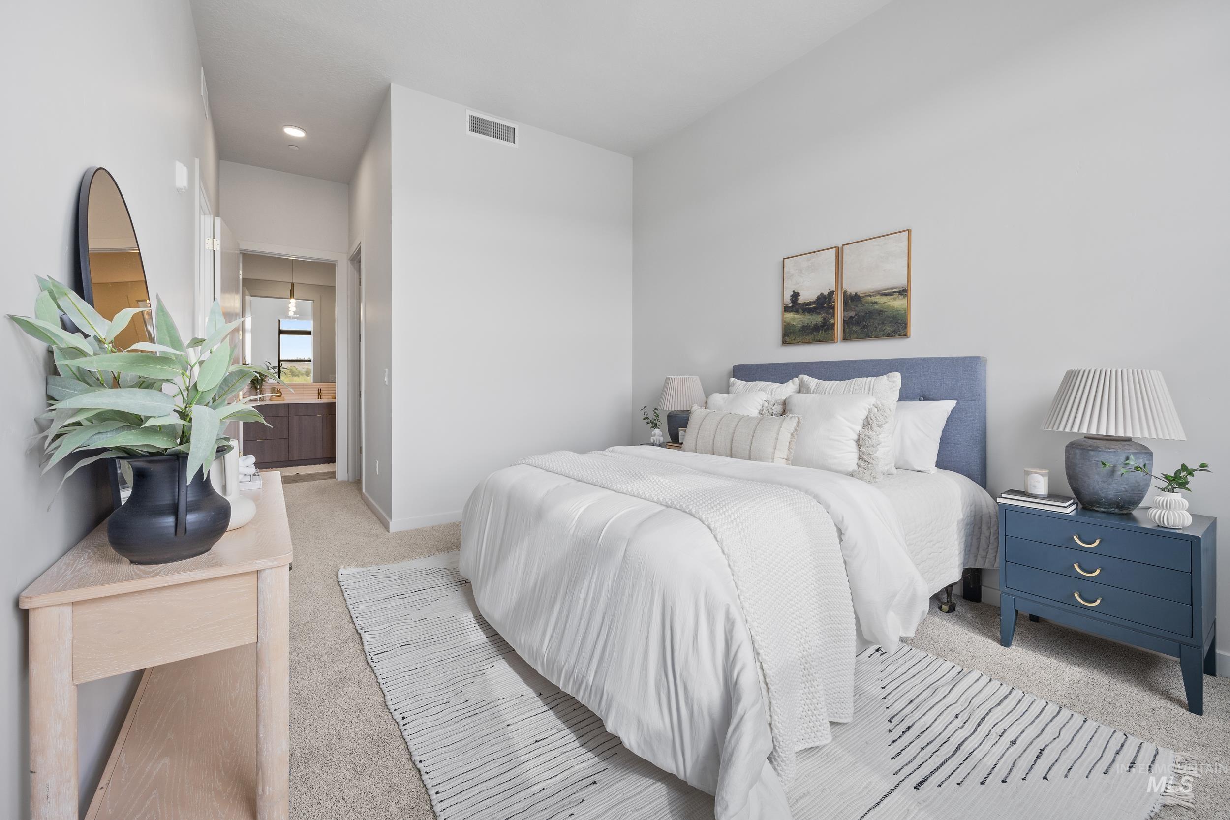 4340 East Haystack Street, Unit 305 Boise, ID 83716 - Photo 16 of 50 Carpeted bedroom with connected bathroom and baseboards