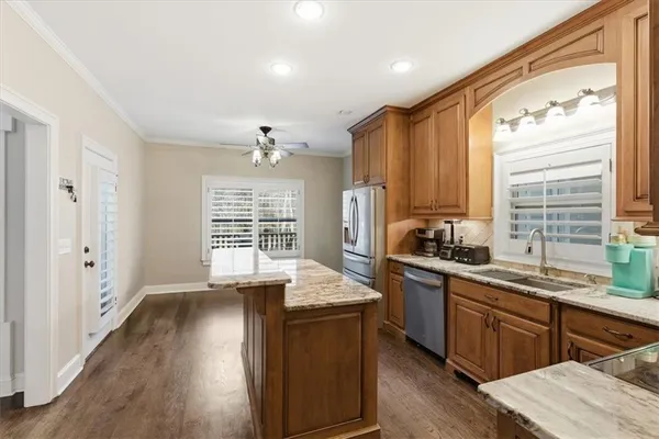 a view of an empty room with a ceiling fan