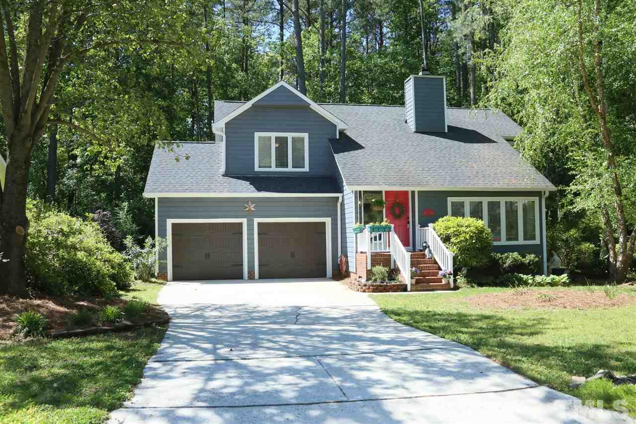 321 Bentpine Drive Raleigh, NC 27603 - Photo 1 of 30 a front view of a house with a yard and garage