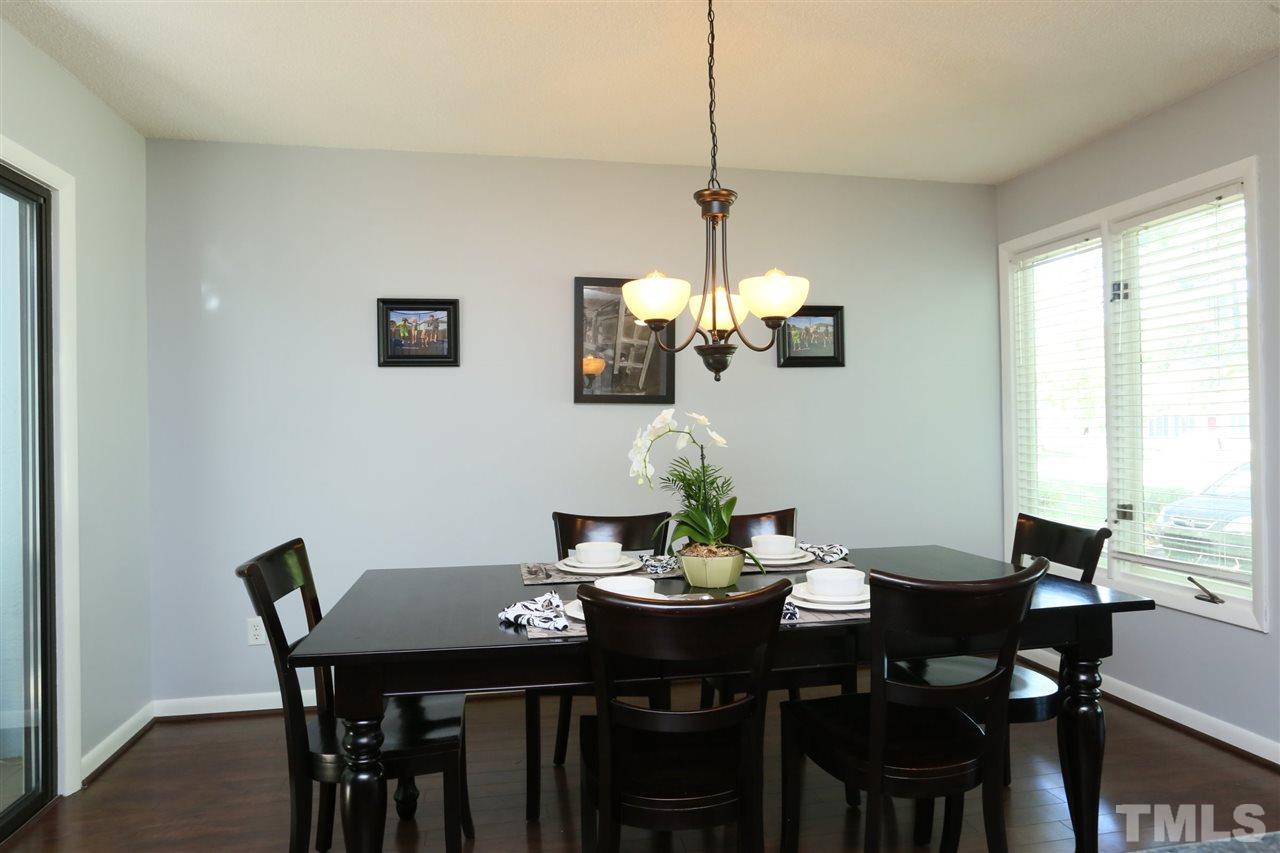 321 Bentpine Drive Raleigh, NC 27603 - Photo 11 of 30 a view of a dining room with furniture window and outside view