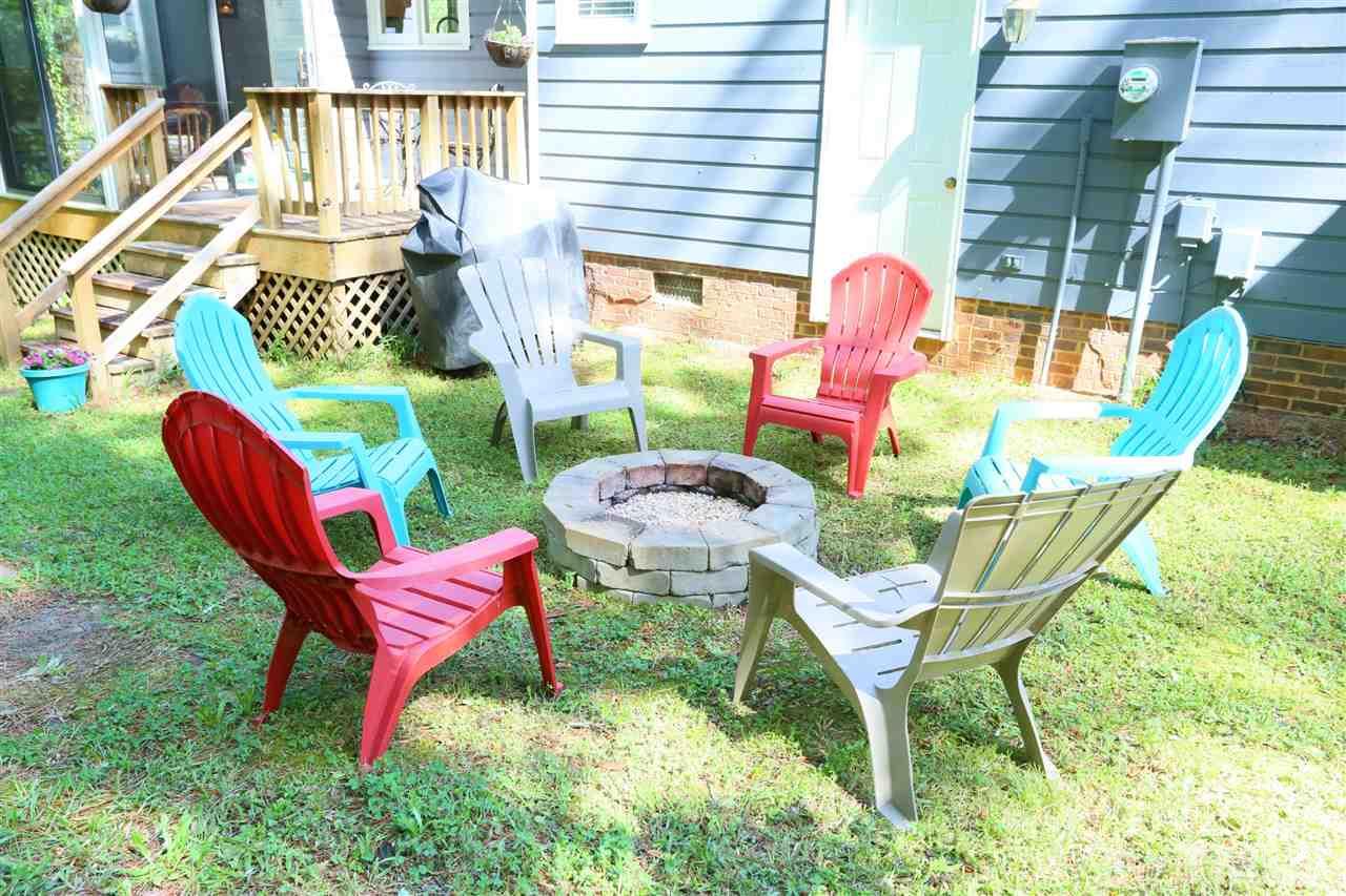 321 Bentpine Drive Raleigh, NC 27603 - Photo 19 of 30 a chair and tables in the patio