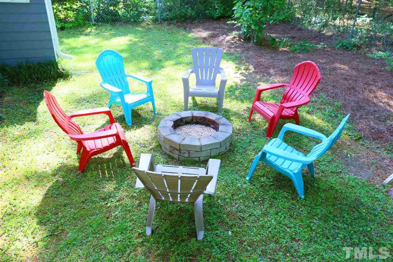 321 Bentpine Drive Raleigh, NC 27603 - Photo 20 of 30 a view of a chair and table in backyard of the house