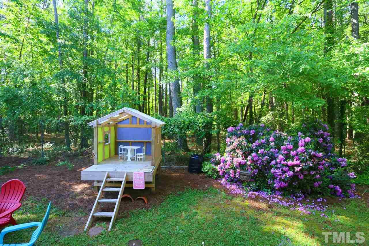 321 Bentpine Drive Raleigh, NC 27603 - Photo 21 of 30 a view of a chairs and table in backyard of the house